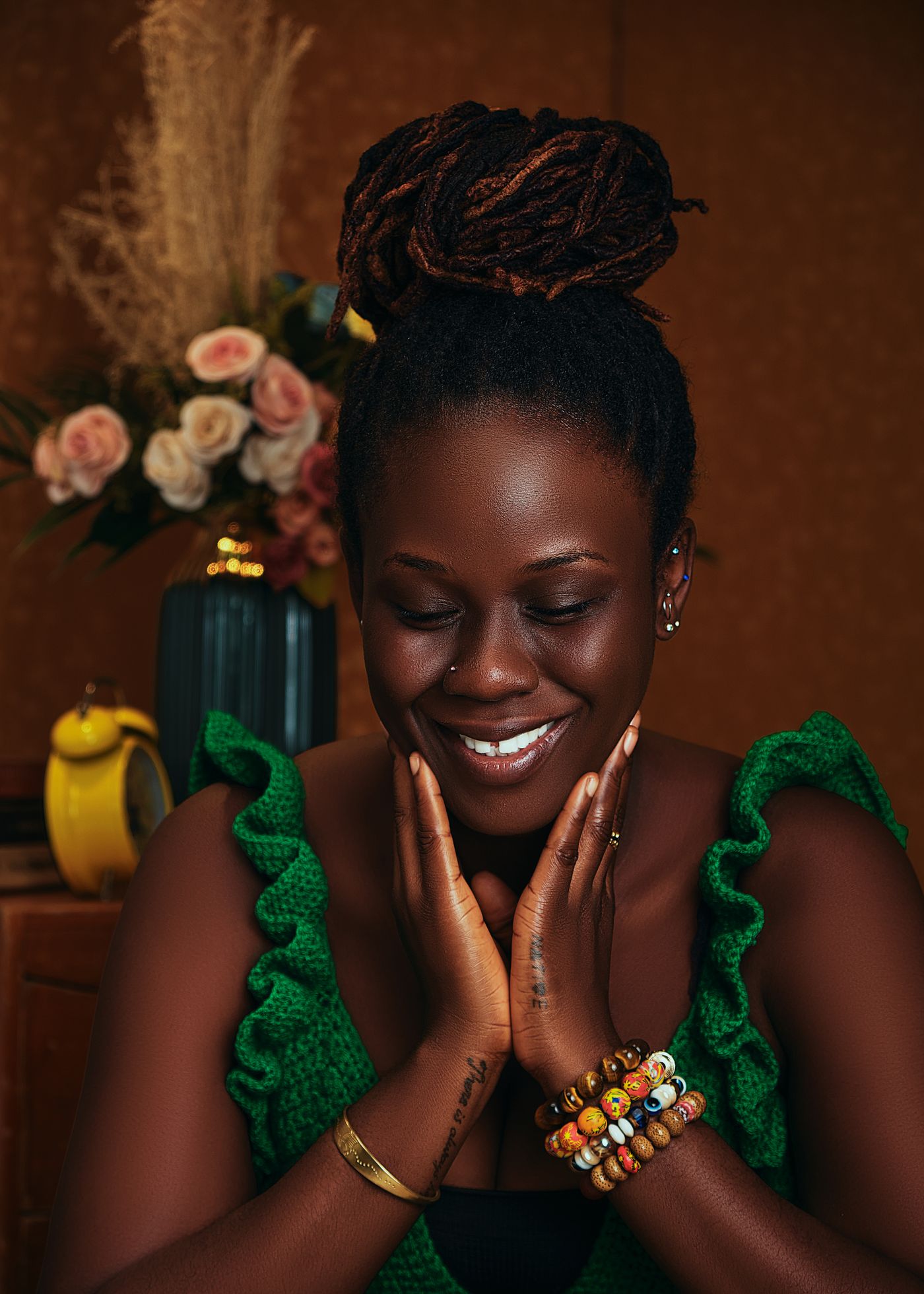 Locs styled in a high bun